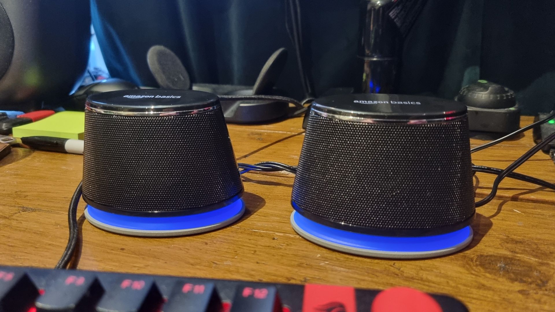 The Amazon Basics Stereo 2.0 Speakers arranged on a desktop in front of a gaming keyboard