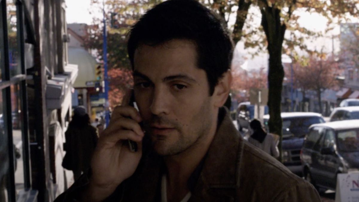 Ryan (Michael Landes) speaks on the phone in Possession