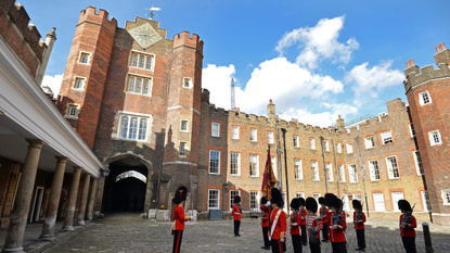 The St James's Palace detachment of The Queen's Guard turns out in Colour Court, St James Palace, for the arrival of Britain's Queen Elizabeth II, ahead of the christening of Prince George by the Archbishop of Canterbury on October 23, 2013.