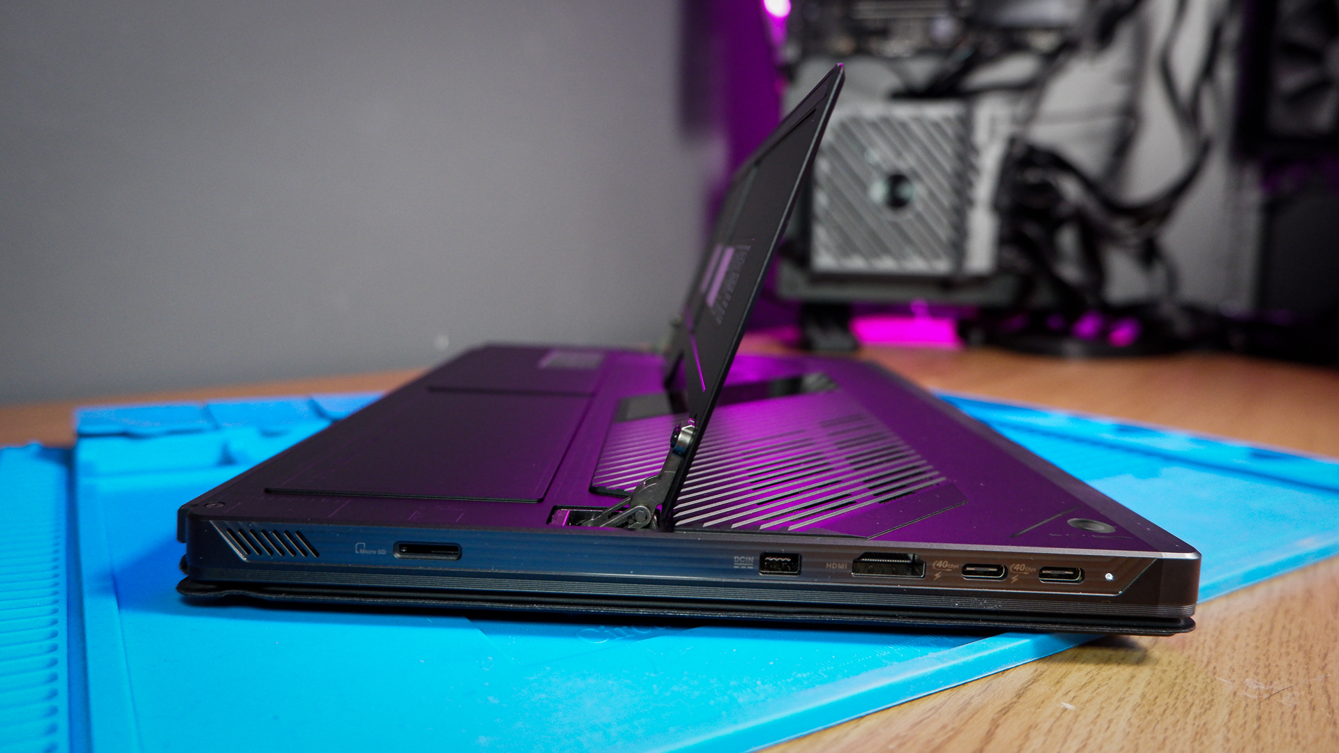 An ROG Flow Z13 (2025) set up on a desk with the detachable keyboard and charger.