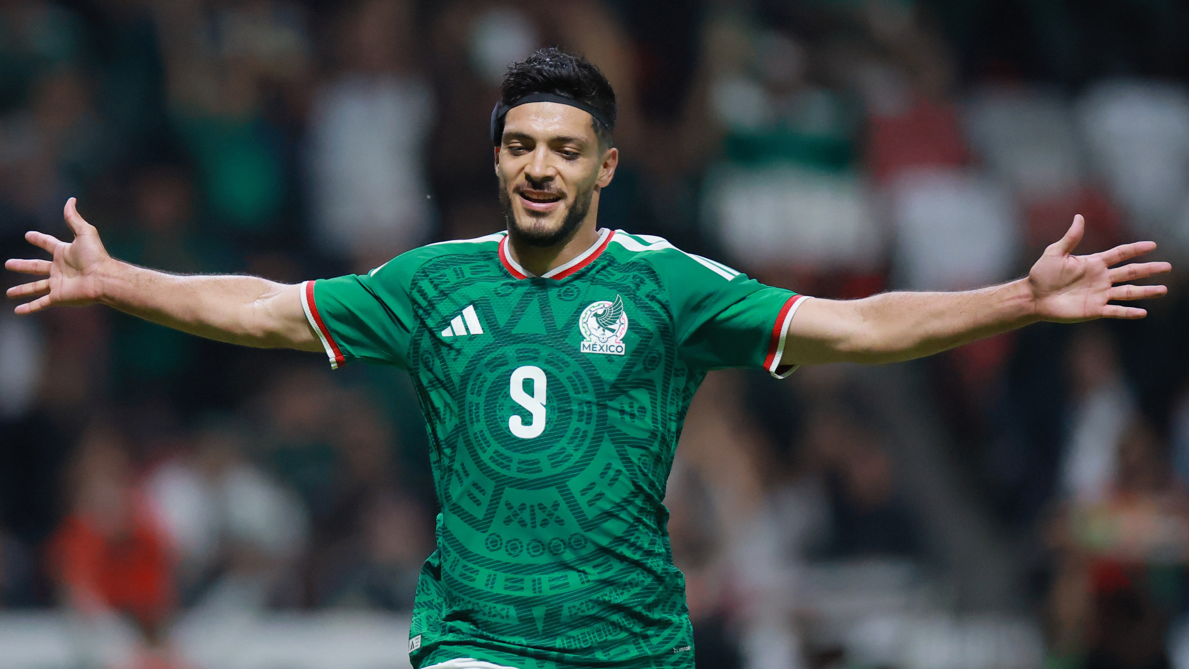 Raúl Jiménez of Mexico celebrates the team's second goal scored by an own goal of Stefan Bukinac of Serbia (not in frame) during the international friendly match between Mexico and Serbia