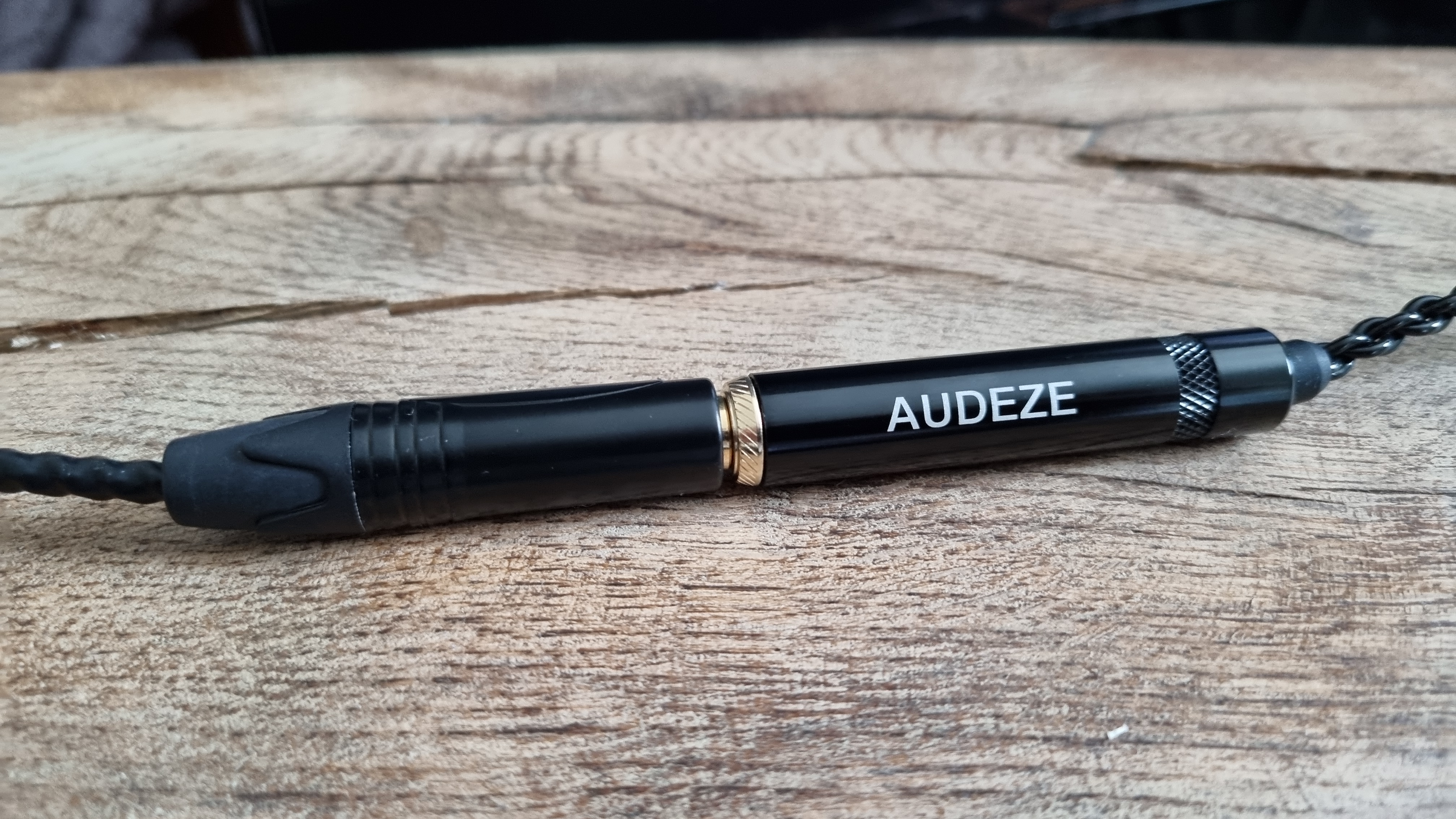 The 3.5 mm in-line adaptor of the Audeze MM-100 