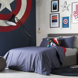 navy blue bedroom with mural and oversized floor lamp