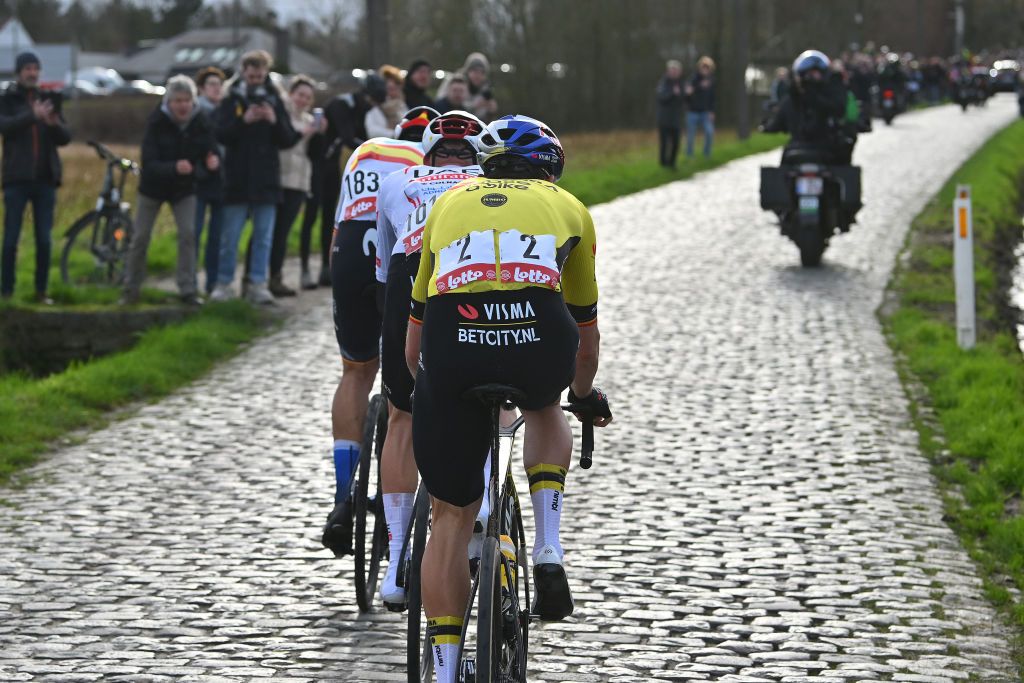 KUURNE BELGIUM FEBRUARY 25 Detailed view of Oier Lazkano Lopez of Spain and Movistar Team Tim Wellens of Belgium and UAE Team Emirates and Wout Van Aert of Belgium and Team Visma Lease A Bike compete in the breakaway during the 76th Kuurne Bruxelles Kuurne 2024 a 1964km one day race from Kortrijk to Kuurne on February 25 2024 in Kuurne Belgium Photo by Luc ClaessenGetty Images