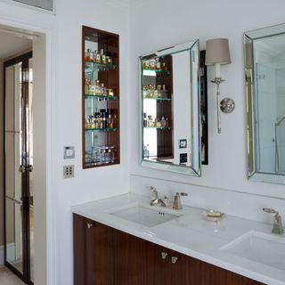 bathroom with twin basin and white wall