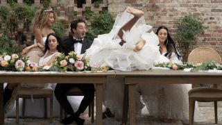 Evalin Clark flies over a table on Joey Graziadei's season of The Bachelor.