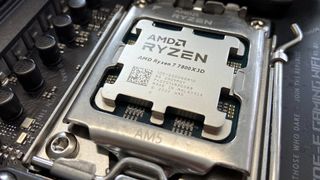 AMD Ryzen 7 7800X3D CPU in an ASUS X670E-E motherboard socket