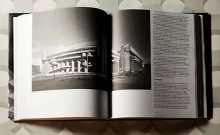 A double page inside a book featuring a picture of The Mental Health Building at the Boston Government Service Cente with text in the right column.