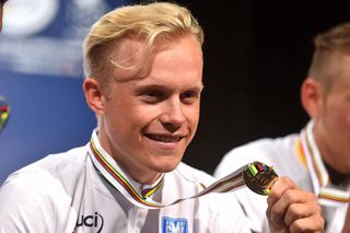 Mads Wurtz Schmidt (Denmark) smiles with his gold medal at the World Championships