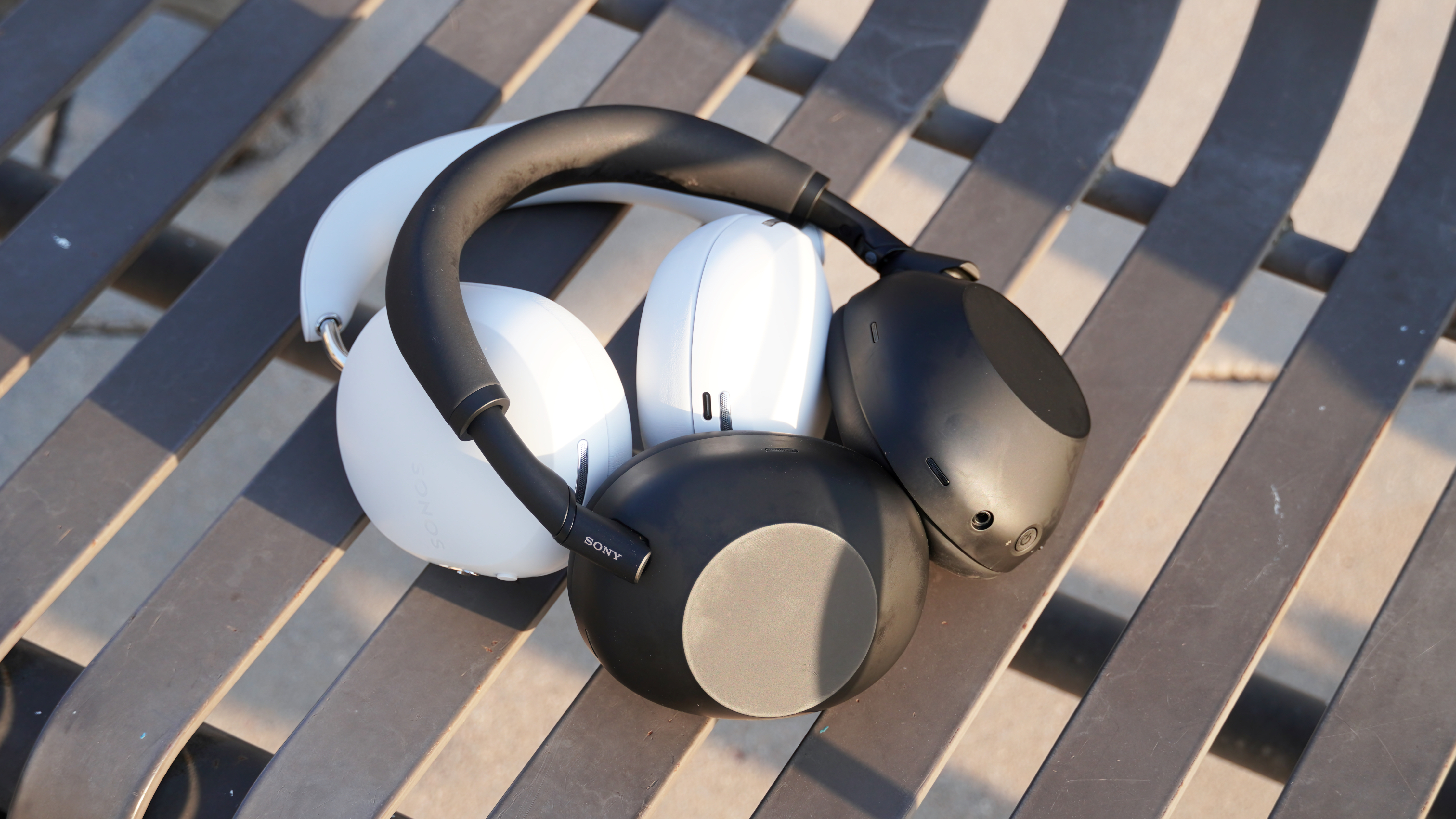 The Sonos Ace in white beside the Sony WH-1000XM6 in black.