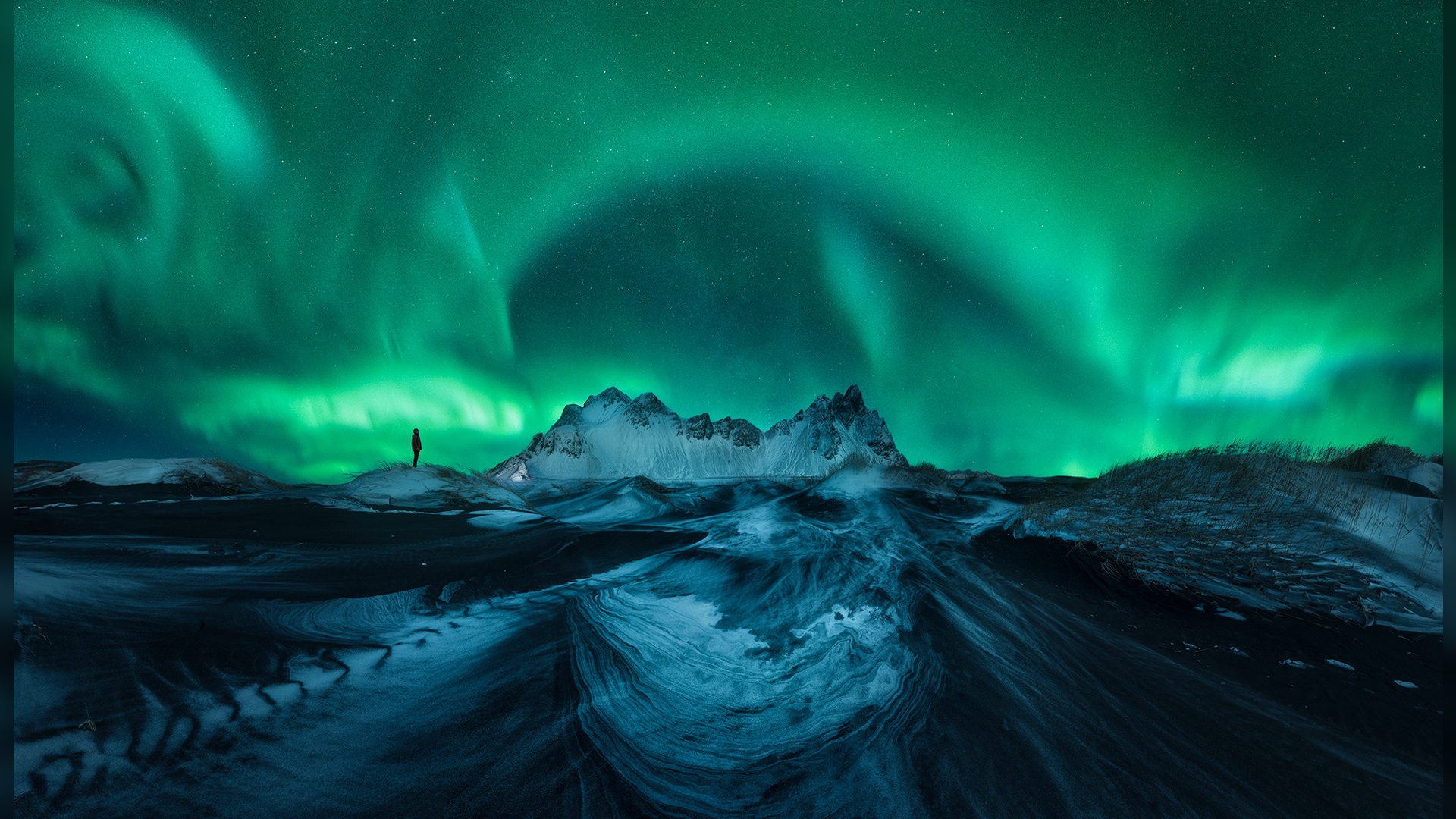 A photo of the northern lights, part of the travel photography blog Capture the Atlas 2022 Northern Lights Photographer of the Year collection. This image was taken by Asier Lopez Castro.