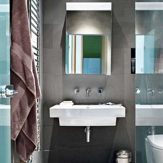 bathroom with towel and mirror