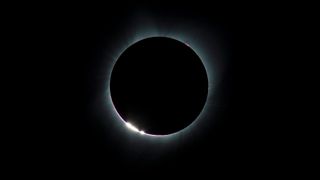 The Baily’s Beads effect is seen as the moon makes its final move over the sun during the total solar eclipse on Monday, Aug. 21, 2017, above Madras, Oregon. Credit: NASA/Aubrey Gemignani