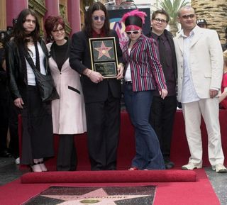 Sharon and Ozzy Osbourne and their children, including Ozzy's son from his first marriage in the white suit (Nick Ut/UP)
