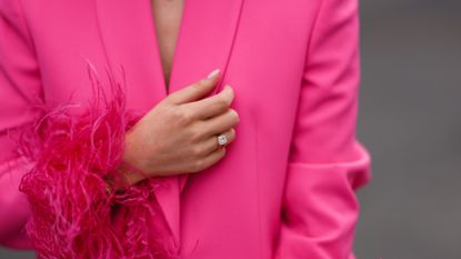 Leo Eberlin is seen wearing an engagement ring, a pink blazer two-piece with feather details from Zara, diamond necklace from Leo Mathild and Leo Mathild diamond ring, on September 04, 2022 in Berlin, Germany.