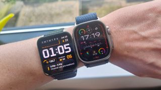 Garmin Venu X1 on wrist alongside Apple Watch Ultra 2
