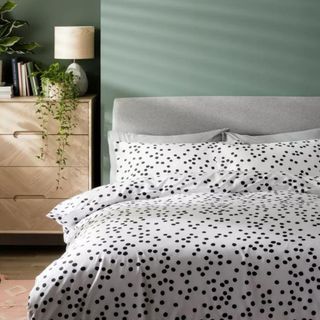 White bedding with black polka dots