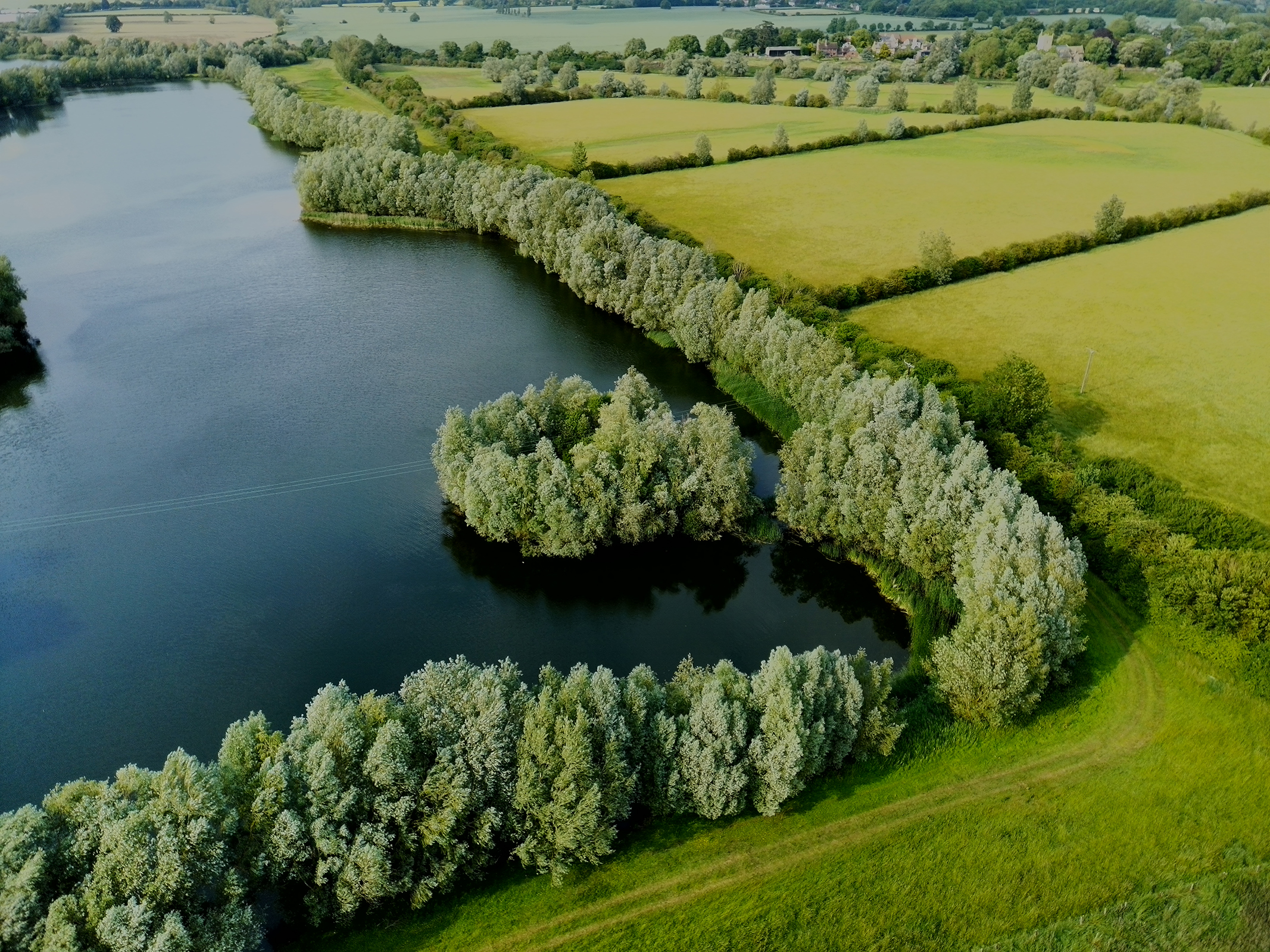 Photo of a lake and fields taken with the Ruko U11MINI 4K drone