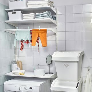 bathroom with adjustable shelves and washing machine
