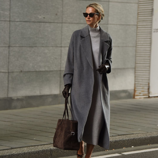 @anoukyve wearing a grey knit dress and coat