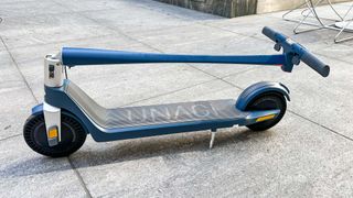 Unagi Model One Voyager parked on sidewalk