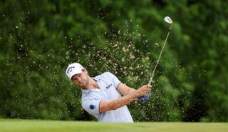 Thomas Detry hits a wedge shot from the bunker