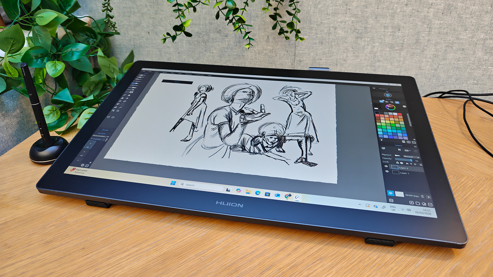 A black drawing tablet on a desk