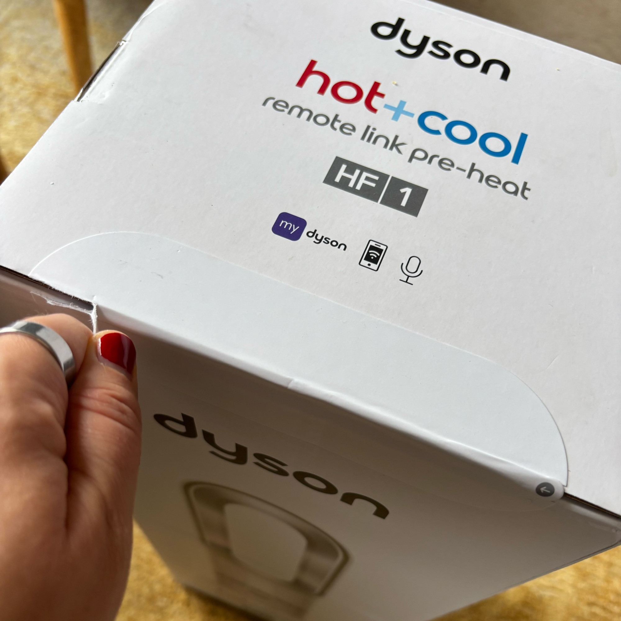 dyson hotcool pre heat heater and cooling fan box being opened
