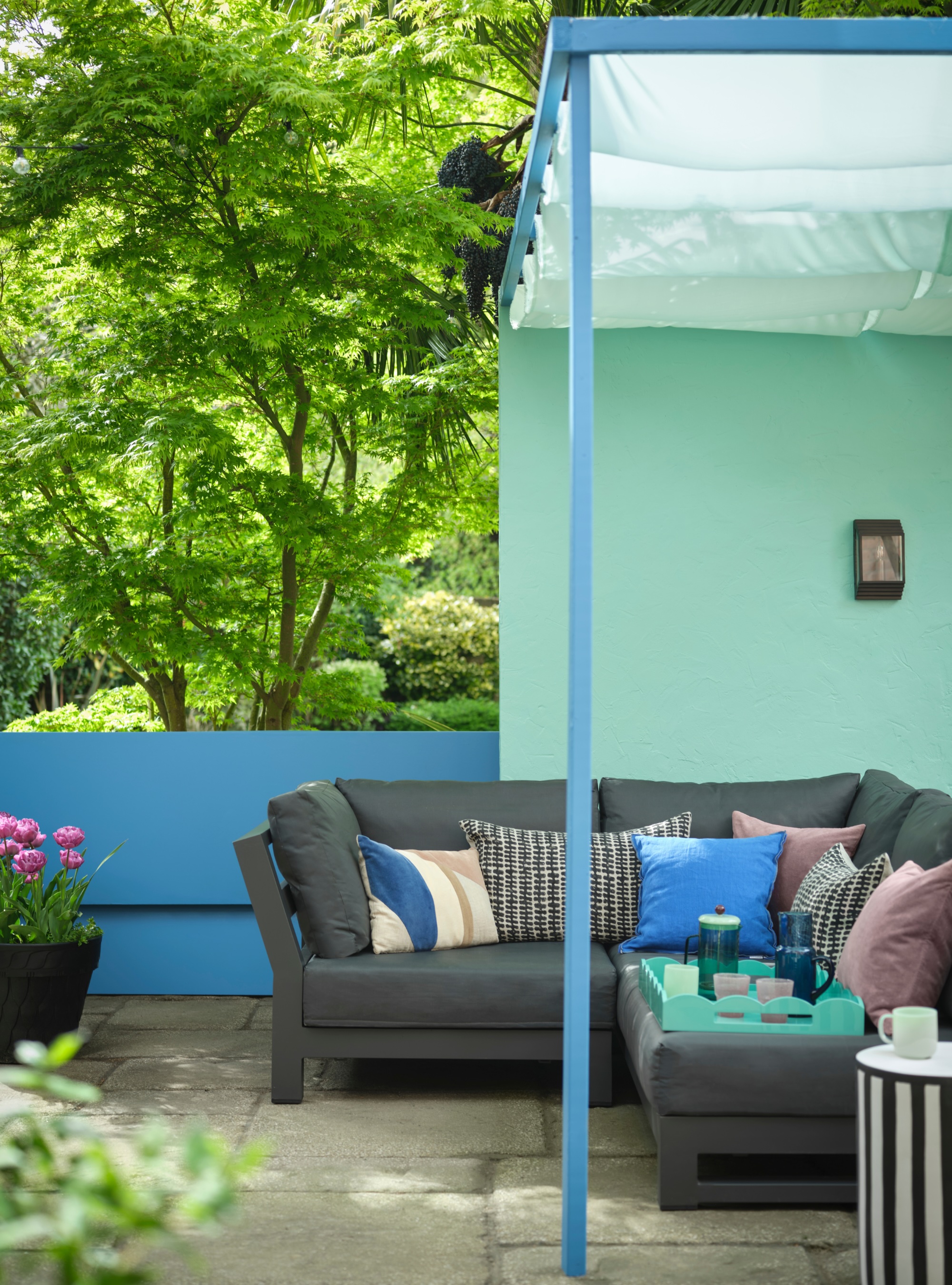 bright blue pergola painted in Benjamin Moore paint