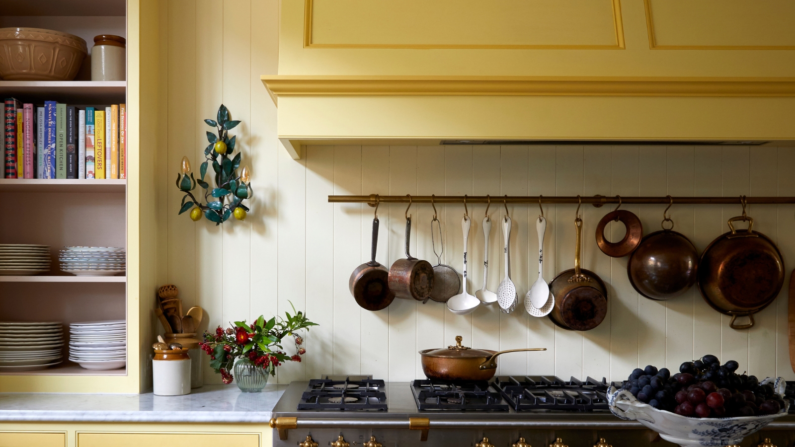 vintage yellow kitchen with hanging copper pots