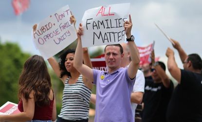 Protesters ask Sen. Marco Rubio to stop opposing the inclusion of LGBT families in the immigration reform on May 22.