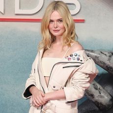 Elle Fanning walked the red carpet at the Predator: Badlands premiere in a custom leather look from Coach