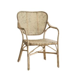 A light brown rattan armchair