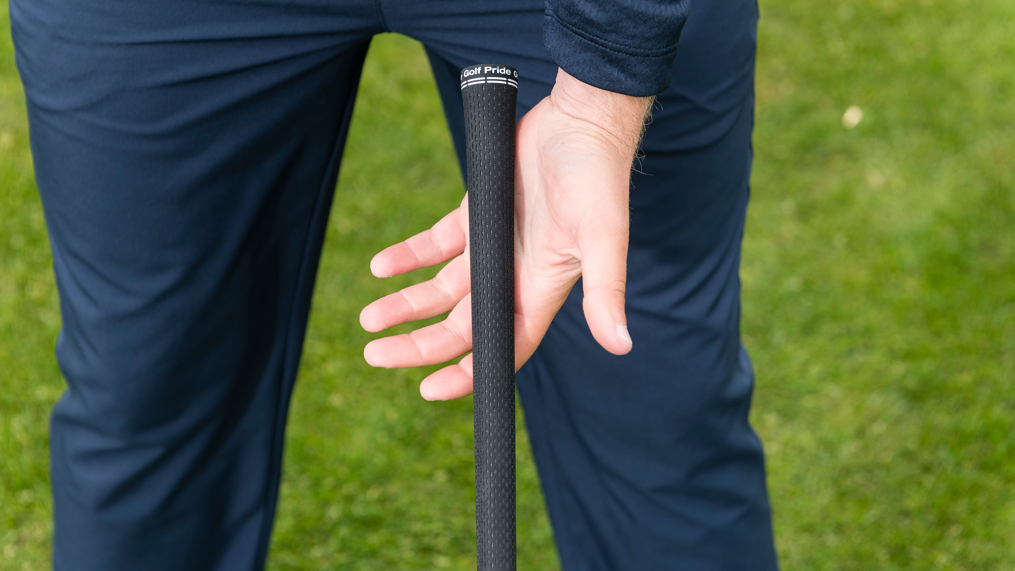 PGA pro Liam James showing how to grip a golf club with your lead hand