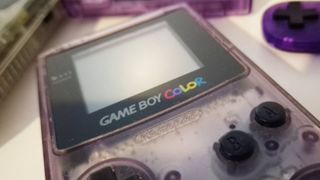 Photo taken by writer Rosalie Newcombe of an Atomic Purple Game Boy Color.