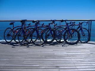 The bikes of the team hanging out at the beach in South Africa