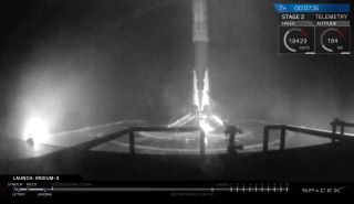 A SpaceX Falcon 9 rocket first stage stands atop the drone ship "Just Read The Instructions" in the Pacific Ocean after successfully launching 10 Iridium Next satellites into orbit from California's Vandenberg Air Force Base on Oct. 9, 2017.