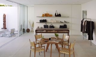 Room with shelves on wall and wooden chairs