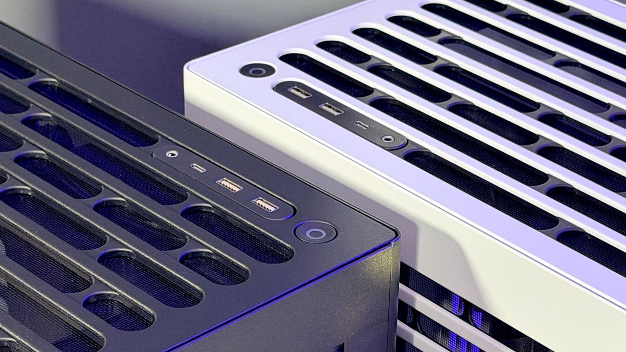The Havn HS 360 PC case in black and white on a desk.