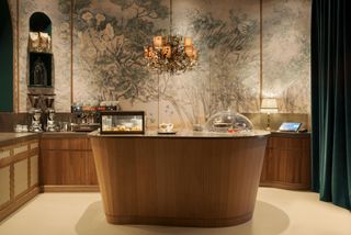 Romanengo Milan interior with counter and patterned wallpaper