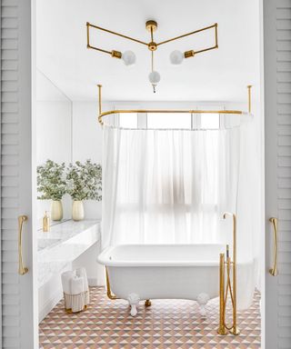 Jack and Jill bathroom with white color scheme and sliding doors