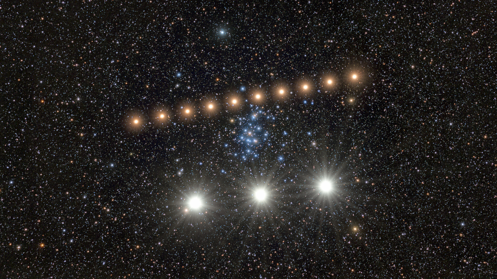 A series of bright golden dots form a diagonal line in the center of a starry night, with three larger whiter dots at the bottom of the image.