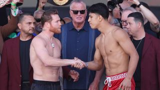 Canelo (L) and Munguia (R) shake hands at the weigh-in