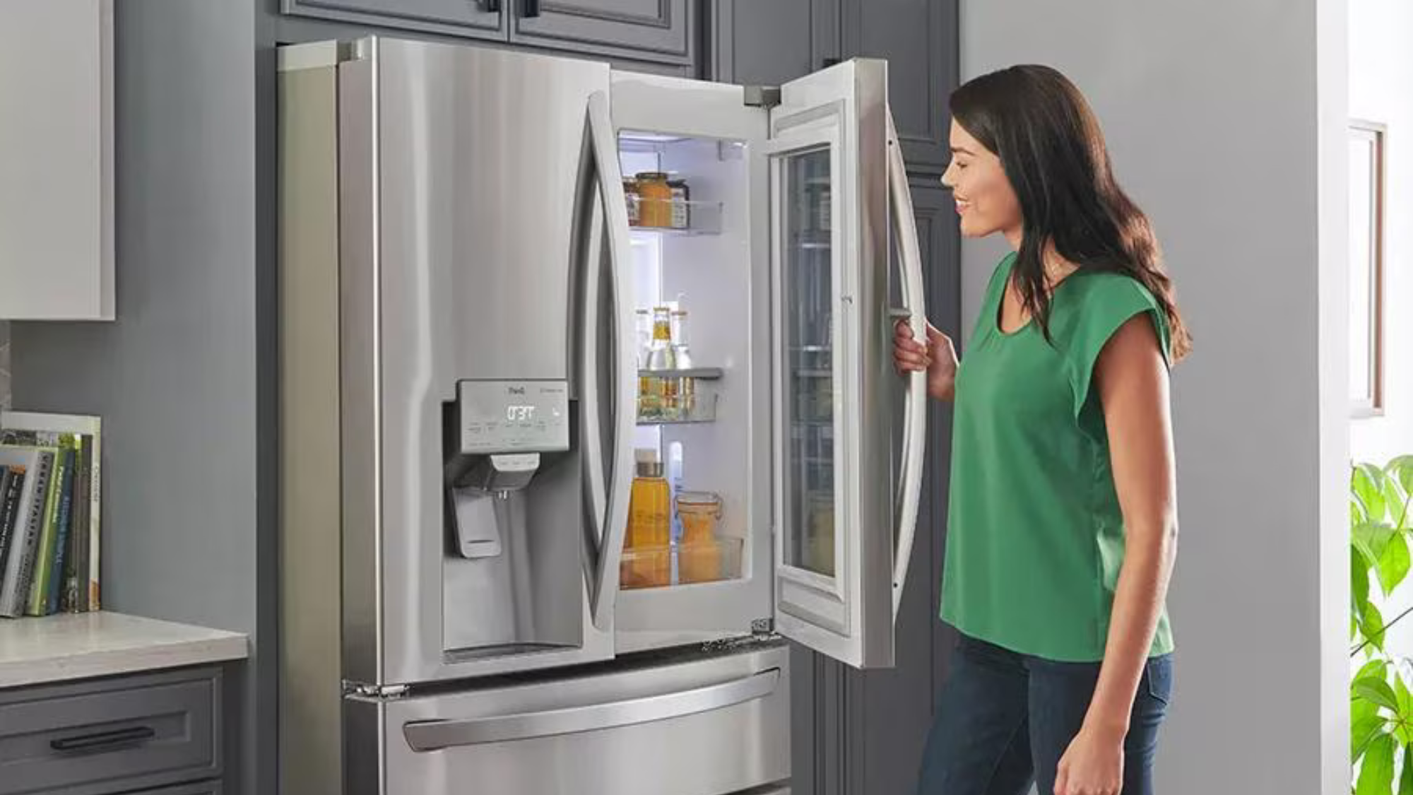 Lady opening an LG fridge