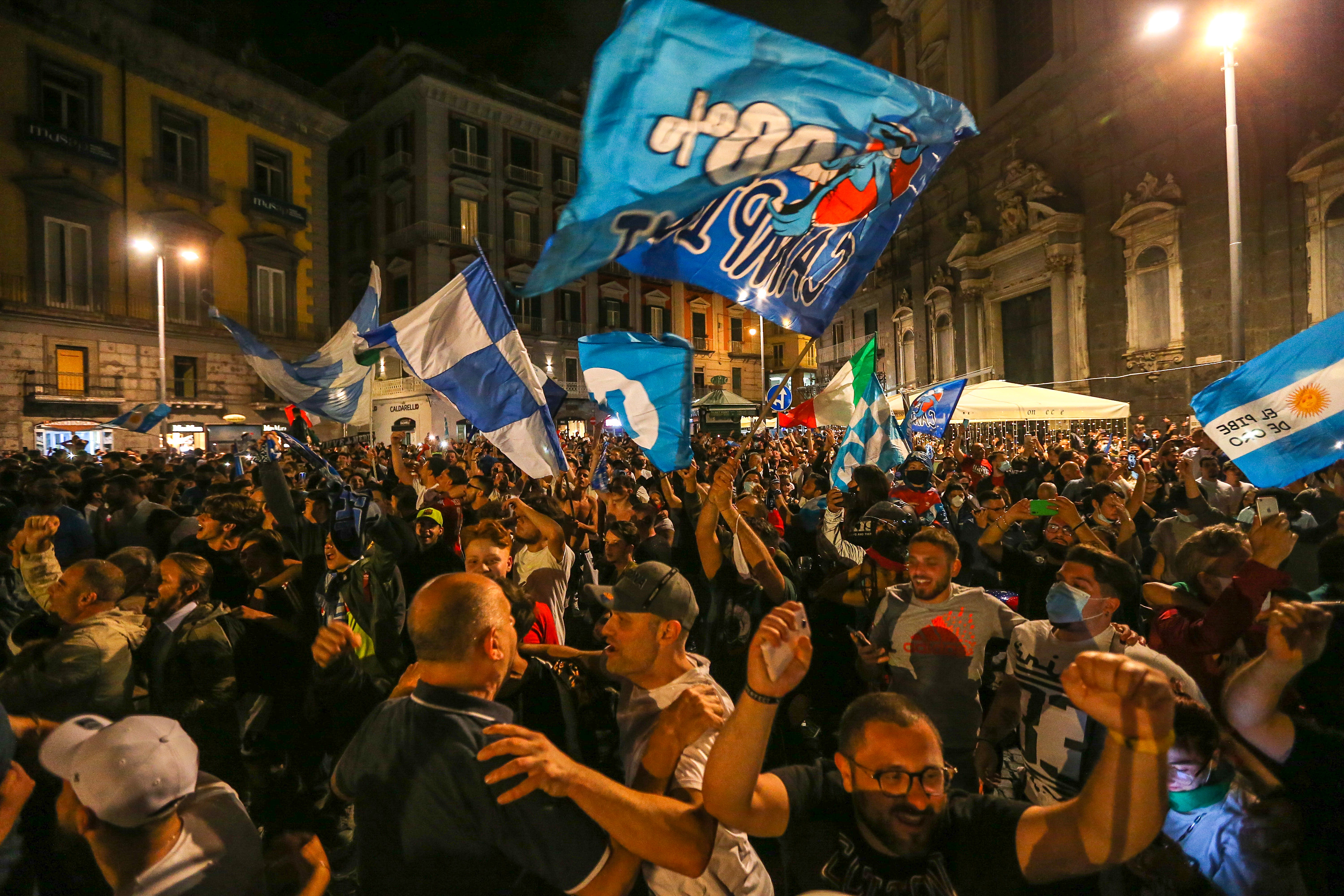 Napoli fans ignore Covid-19 social distancing regulations as thousands take to the streets to celebrate their team's Coppa Italia final win over Juventus in June 2020.