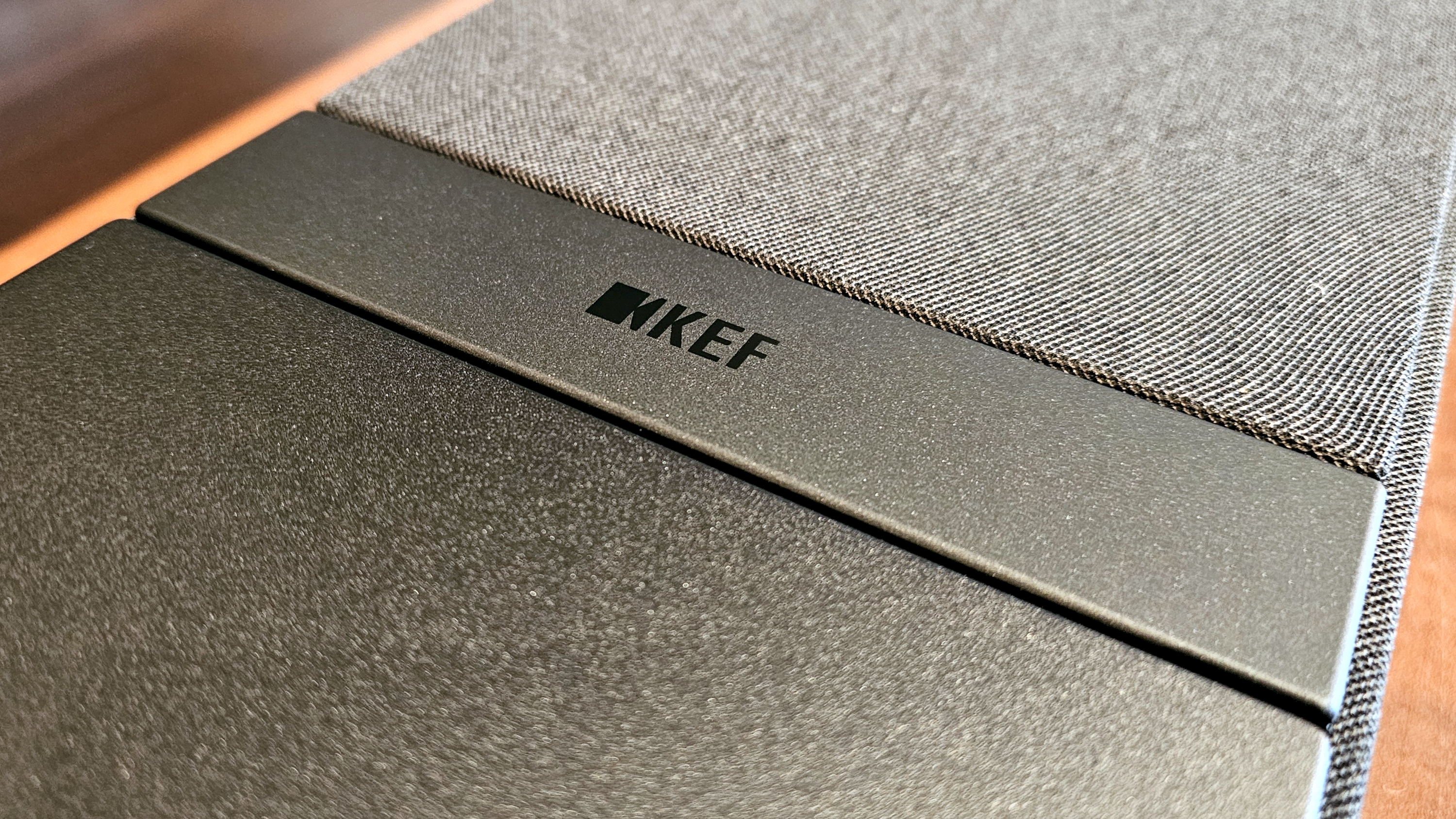 KEF XIO on table. Close up shots showing design features