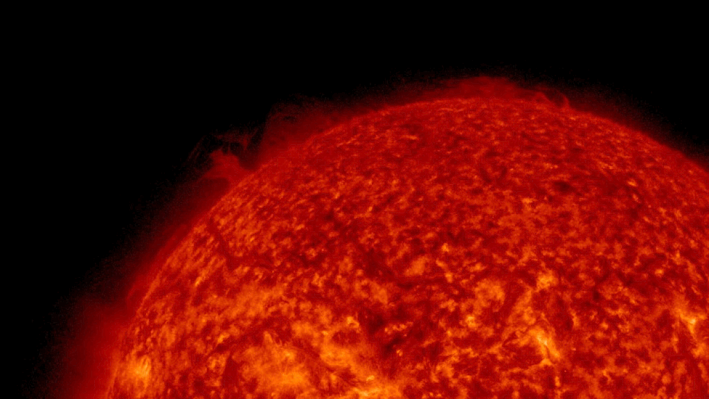Looped video footage of a massive plasma eruption coming from the sun's far side