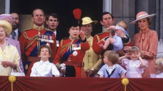 Queen Elizabeth II with (from left) Queen Elizabeth the Queen Mother, Prince Michael of Kent, Prince Phillip, Lord Nicholas Windsor, Prince Edward, Princess Anne, Prince Charles holding Prince Harry, Diana, Princess of Wales, in front of her Prince William, on the balcony of Buckingham Palace at the Trooping the Colour ceremony in London on June 15, 1985.