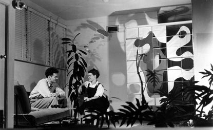 Black and white portrait of Charles and Ray Eames