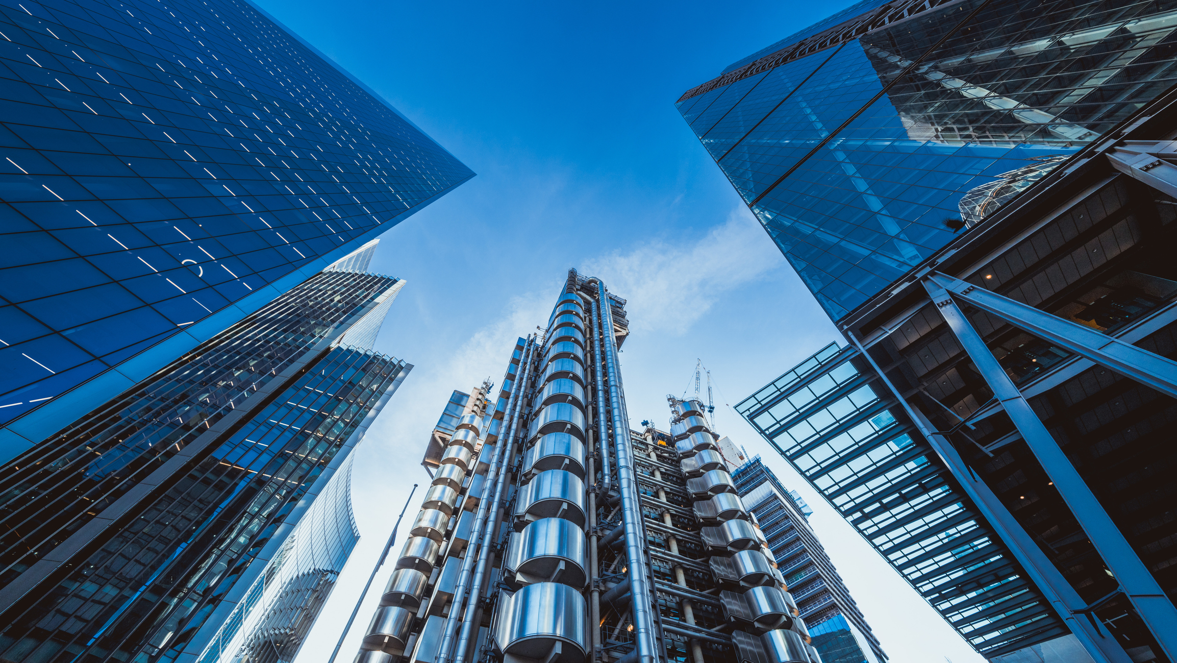 Looking directly up at the skyline of the financial district in central London